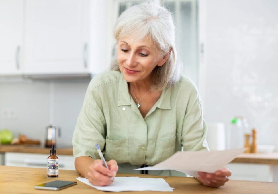 senior-woman-calculates-CBD-dose-using-a-standard-calculation-formula